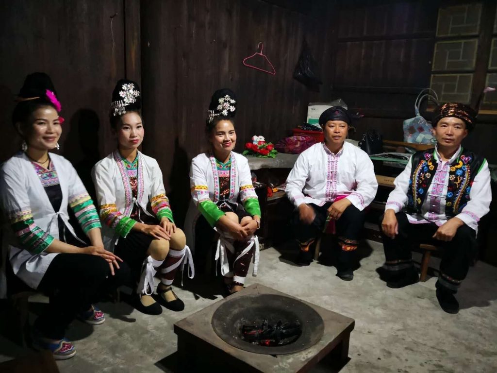 Colin Mackerras with Dong performers in a private Dong house in Zhaoxing, Guangxi 2018