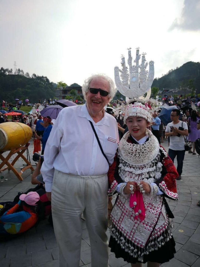 Colin Mackerras and Miao woman in costume for the May Day dance, 2018